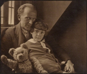 A.A. Milne poses with his son, Christopher Robin Milne and a stuffed Winnie-the-Pooh/Photo by Howard Coster, 1926