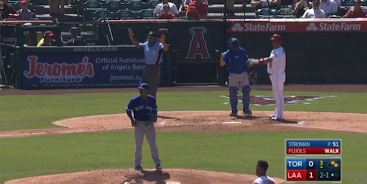 Umpire waves off play while a swarm of bees take over the field in Anaheim/MLB